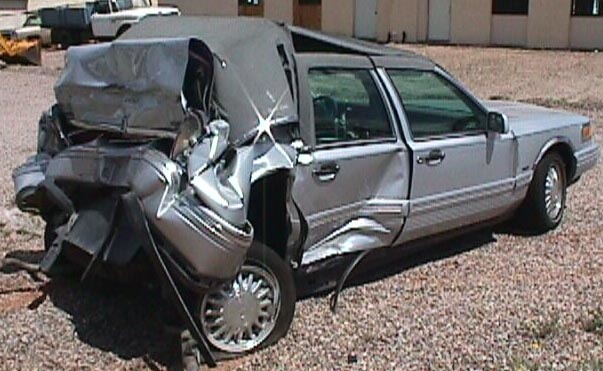 Gray car destroyed by a car crash